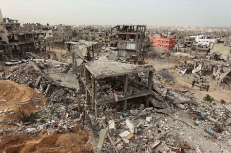The rubbles of houses, which were destroyed during the recent Israeli offensive on Gaza Strip, are seen in the last day of 2014, in Shijaiyah neighborhood